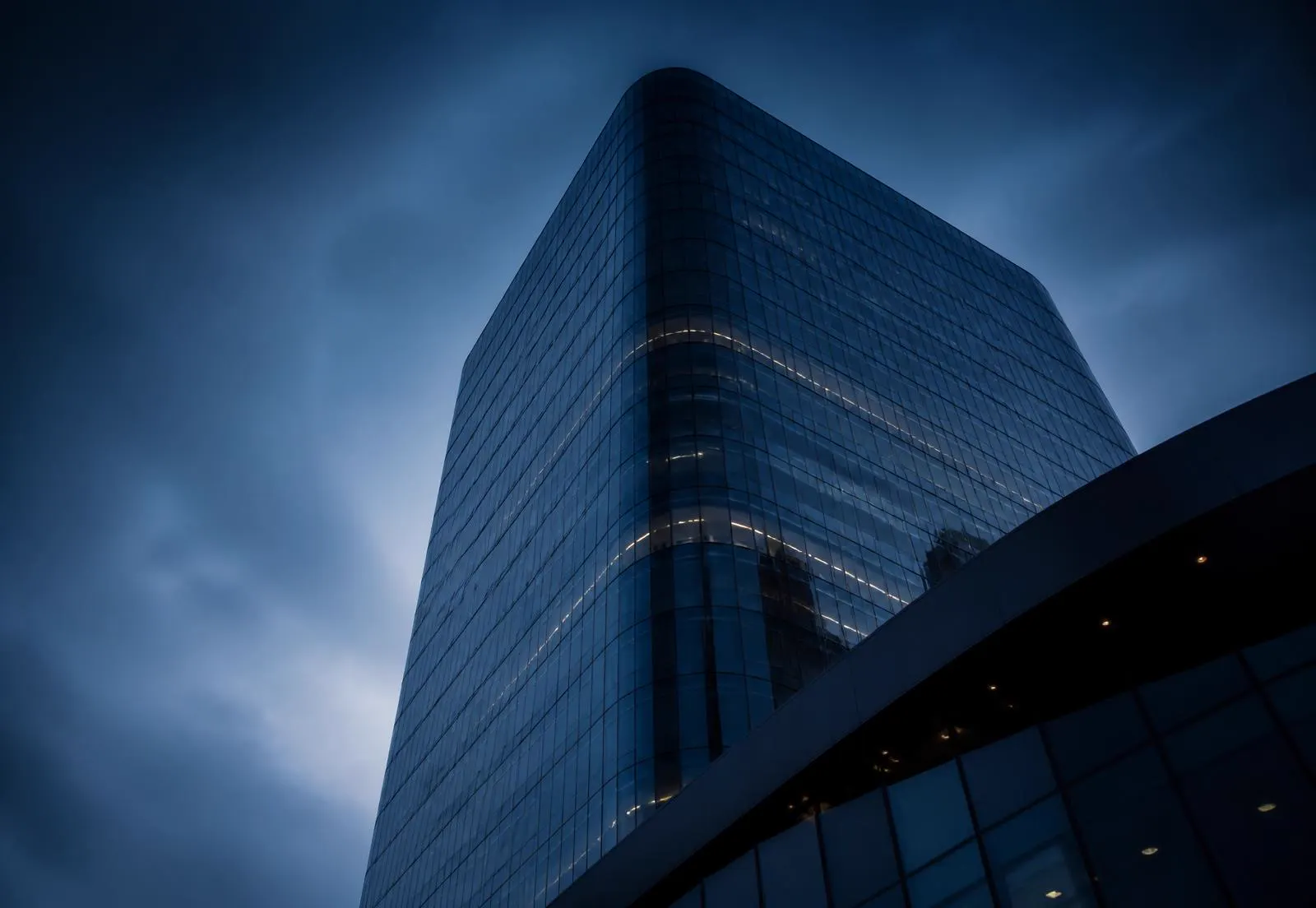 Modern corporate tower at dusk